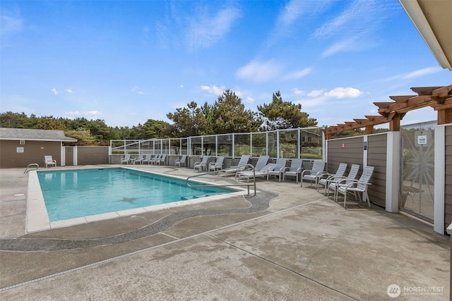 community pool featuring a pergola, a patio area, and fence