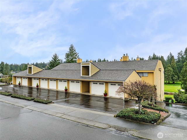 25126B 142nd Ave SE, Kent, WA 98042 - view of front of house featuring community garages and a chimney