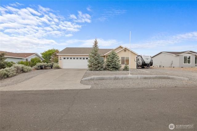 336 Spring Cir SW, Mattawa, WA 99349 - view of front of home featuring an attached garage and concrete driveway