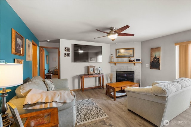 336 Spring Cir SW, Mattawa, WA 99349 - living area with a ceiling fan, light wood-type flooring, and a tile fireplace