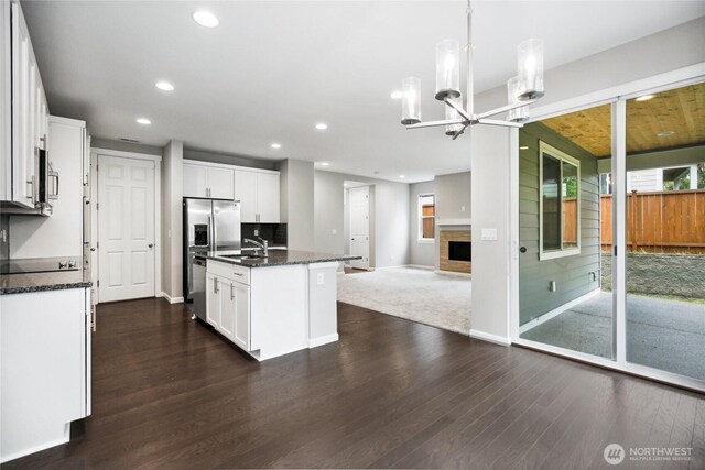 4933 Wanderlust Way, Gig Harbor, WA 98332 - kitchen with open floor plan, recessed lighting, stainless steel appliances, a chandelier, and dark wood-style floors
