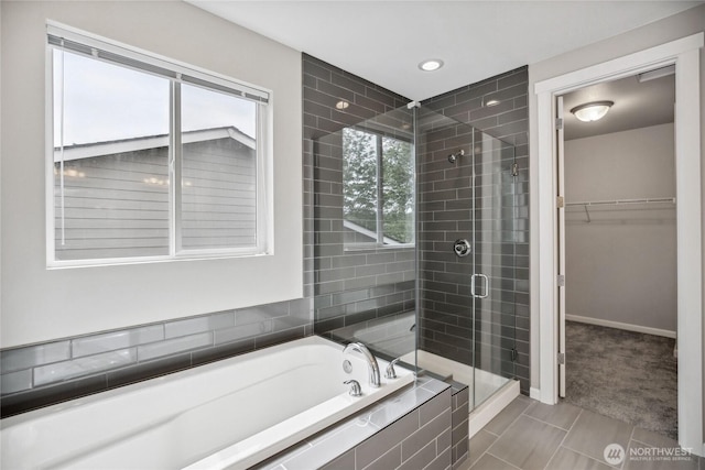 4933 Wanderlust Way, Gig Harbor, WA 98332 - bathroom featuring a shower stall, a walk in closet, a garden tub, tile patterned floors, and recessed lighting