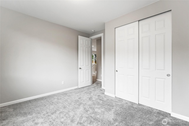 4933 Wanderlust Way, Gig Harbor, WA 98332 - unfurnished bedroom featuring carpet floors, baseboards, and a closet