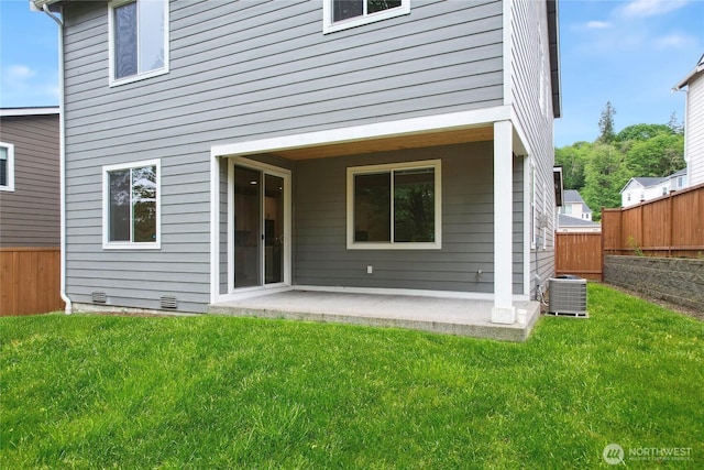 4933 Wanderlust Way, Gig Harbor, WA 98332 - back of property with central AC and a patio