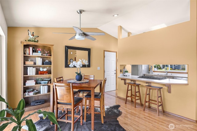 8224 Quinault Rd, Blaine, WA 98230 - dining space with light wood-style floors, ceiling fan, and lofted ceiling
