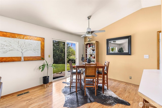 8224 Quinault Rd, Blaine, WA 98230 - dining space featuring wood-type flooring, ceiling fan, baseboards, and vaulted ceiling