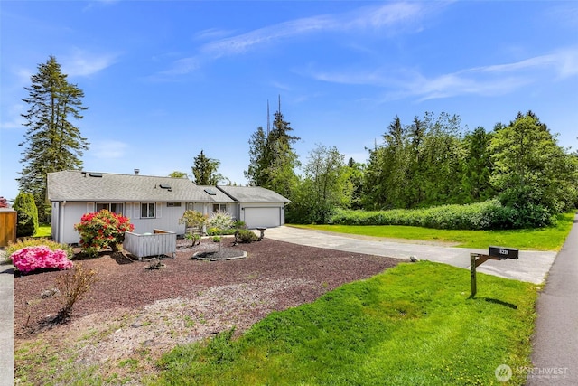 8224 Quinault Rd, Blaine, WA 98230 - view of front of property with concrete driveway, a garage, and a front lawn