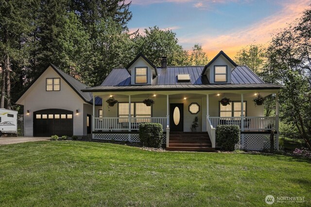 15513 NE Beebe Rd, Battle Ground, WA 98604 - view of front of house with covered porch, a front yard, a standing seam roof, and metal roof