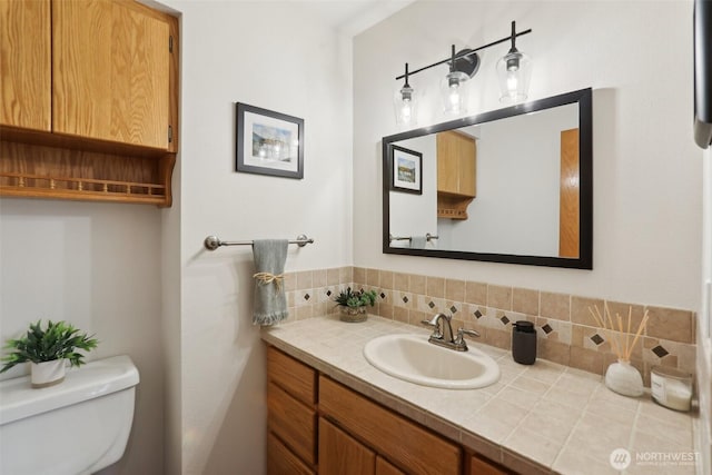 15513 NE Beebe Rd, Battle Ground, WA 98604 - half bathroom featuring toilet, vanity, and backsplash