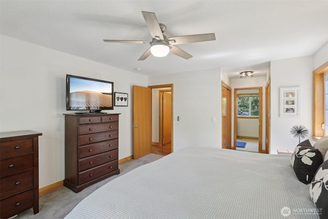 15513 NE Beebe Rd, Battle Ground, WA 98604 - bedroom featuring light colored carpet, baseboards, and a ceiling fan