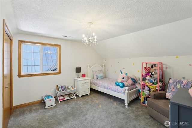 15513 NE Beebe Rd, Battle Ground, WA 98604 - carpeted bedroom with a chandelier, a textured ceiling, and vaulted ceiling