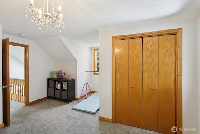 15513 NE Beebe Rd, Battle Ground, WA 98604 - game room featuring carpet floors, a chandelier, baseboards, and lofted ceiling