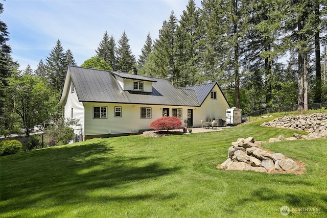 15513 NE Beebe Rd, Battle Ground, WA 98604 - back of house featuring metal roof, a patio, a chimney, and an outdoor structure