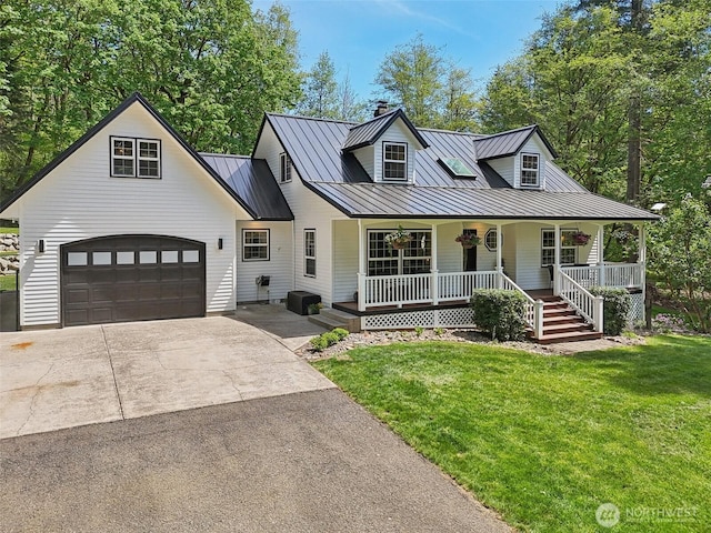 15513 NE Beebe Rd, Battle Ground, WA 98604 - view of front of house with a standing seam roof, driveway, a porch, and a front lawn