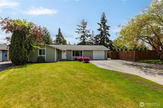 ranch-style house with driveway and a garage
