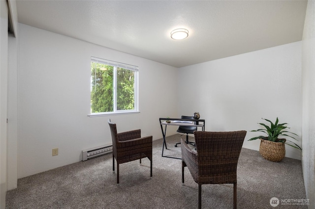 home office featuring a baseboard heating unit and carpet floors