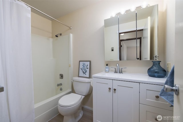 full bath with toilet, vanity, and shower / bath combo