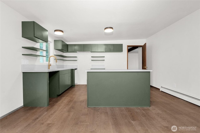 5015 15th Ave SE, Lacey, WA 98503 - kitchen with green cabinets, wood finished floors, open shelves, a center island, and light countertops