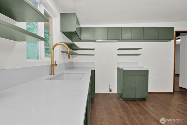 5015 15th Ave SE, Lacey, WA 98503 - kitchen featuring green cabinetry, a sink, open shelves, dark wood-style flooring, and light countertops
