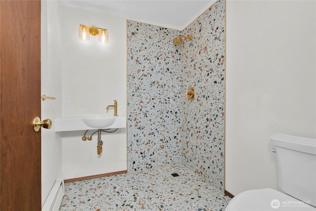 5015 15th Ave SE, Lacey, WA 98503 - bathroom featuring a tile shower, toilet, and baseboards