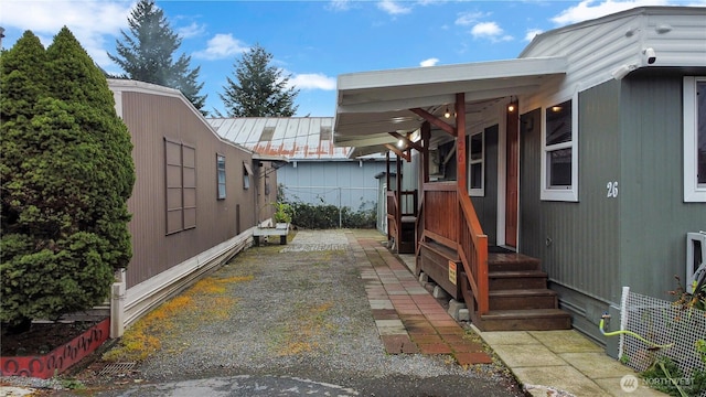 1660 S 333rd St Unit 26, Federal Way, WA 98003 - view of home's exterior with metal roof and fence