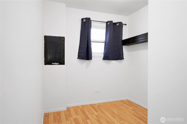 1660 S 333rd St Unit 26, Federal Way, WA 98003 - spare room with electric panel, wood finished floors, and baseboards