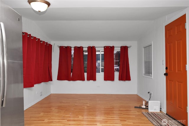 1660 S 333rd St Unit 26, Federal Way, WA 98003 - spare room featuring wood finished floors, baseboards, and vaulted ceiling