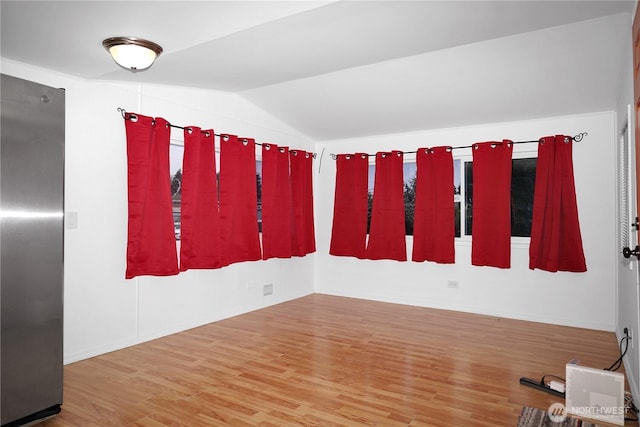 1660 S 333rd St Unit 26, Federal Way, WA 98003 - spare room featuring wood finished floors, lofted ceiling, and baseboards