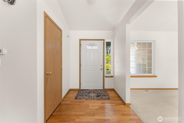 13008 65th Avenue Ct SW, Lakewood, WA 98499 - entrance foyer with light wood-style floors, baseboards, and vaulted ceiling