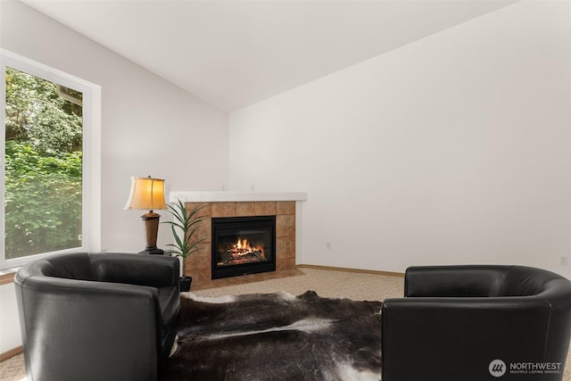 13008 65th Avenue Ct SW, Lakewood, WA 98499 - carpeted living room featuring a fireplace, lofted ceiling, plenty of natural light, and baseboards