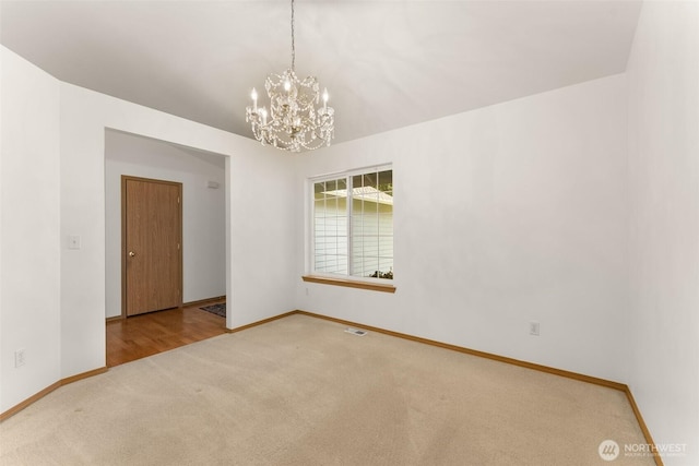 13008 65th Avenue Ct SW, Lakewood, WA 98499 - unfurnished room with carpet flooring, baseboards, and a chandelier