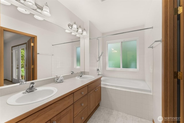 13008 65th Avenue Ct SW, Lakewood, WA 98499 - full bathroom featuring tiled shower / bath combo, double vanity, and tile patterned flooring