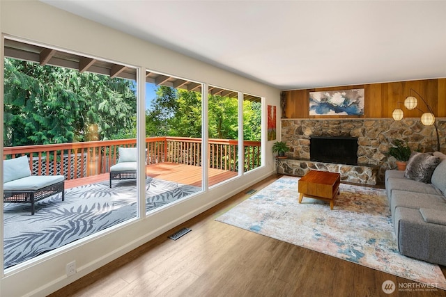13235 68th Pl NE, Kirkland, WA 98034 - living area with wood finished floors, a fireplace, and wooden walls