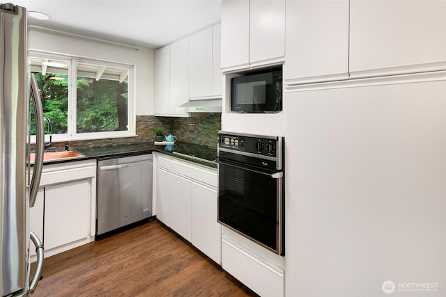 13235 68th Pl NE, Kirkland, WA 98034 - kitchen featuring black appliances, dark countertops, white cabinets, tasteful backsplash, and dark wood-type flooring