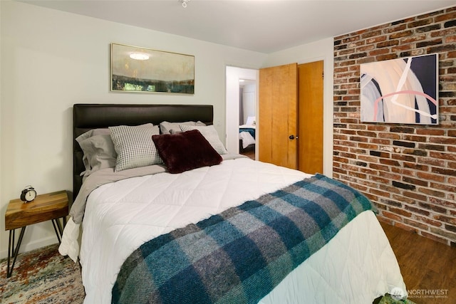 13235 68th Pl NE, Kirkland, WA 98034 - bedroom with wood finished floors and brick wall
