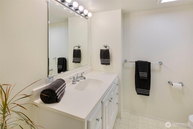 13235 68th Pl NE, Kirkland, WA 98034 - bathroom featuring vanity, baseboards, tile patterned floors, and toilet