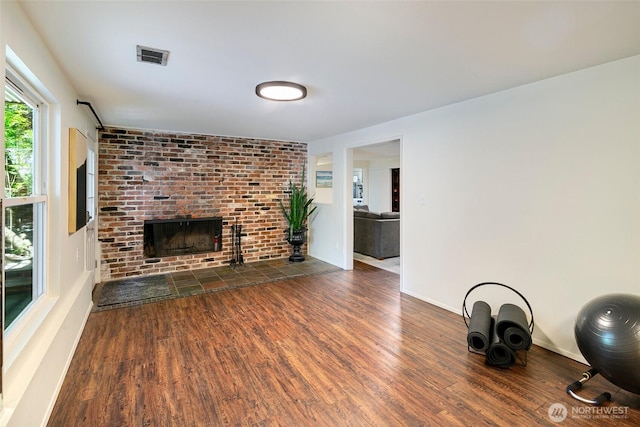 13235 68th Pl NE, Kirkland, WA 98034 - unfurnished living room featuring wood finished floors, a fireplace, and baseboards