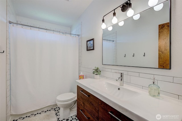 full bathroom with vanity, toilet, tasteful backsplash, a shower with curtain, and tile patterned floors