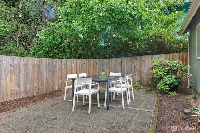 view of patio / terrace with outdoor dining area and a fenced backyard