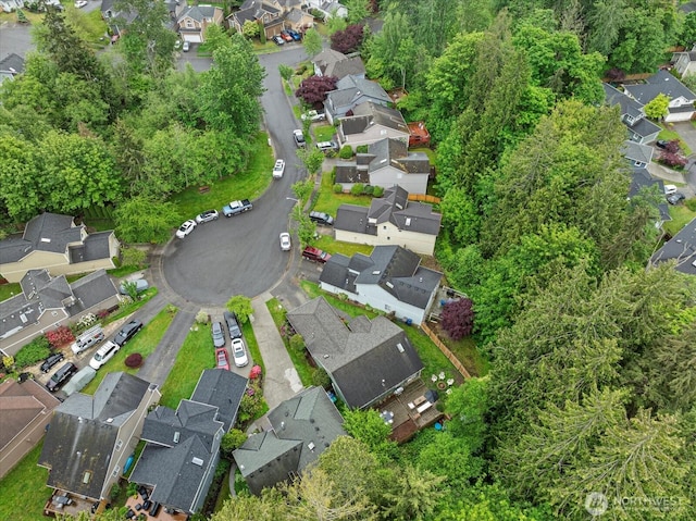 aerial view of property and surrounding area with nearby suburban area
