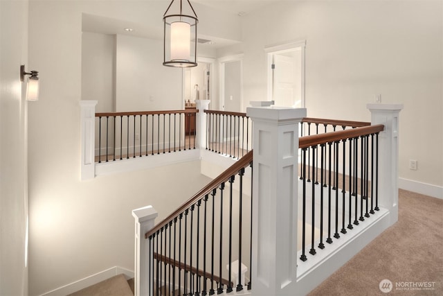 stairway with carpet flooring and baseboards