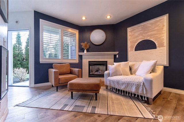 13000 Admiralty Way Unit K103, Everett, WA 98204 - living area with baseboards, wood finished floors, a tile fireplace, and recessed lighting