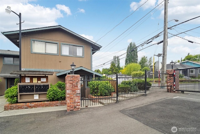 13558 37th Ave S Unit 21, Tukwila, WA 98168 - view of front of property with fence and a gate