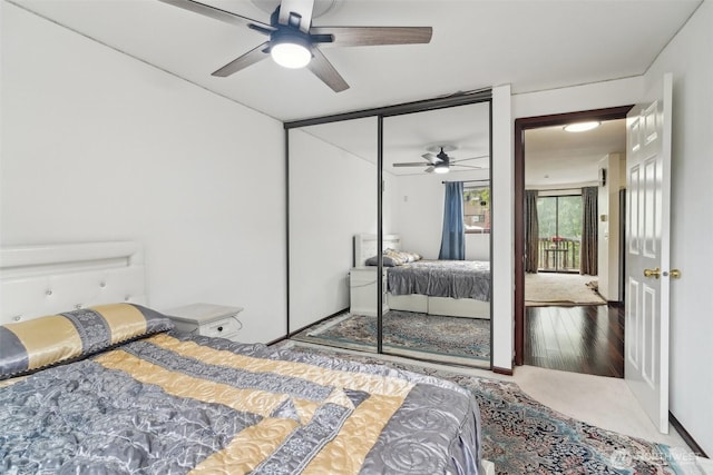13558 37th Ave S Unit 21, Tukwila, WA 98168 - bedroom with wood finished floors, a ceiling fan, and a closet