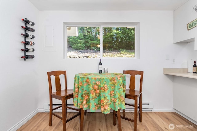 8309 Cirque Dr W Unit 4, University Place, WA 98467 - dining room with wood finished floors, baseboard heating, and baseboards