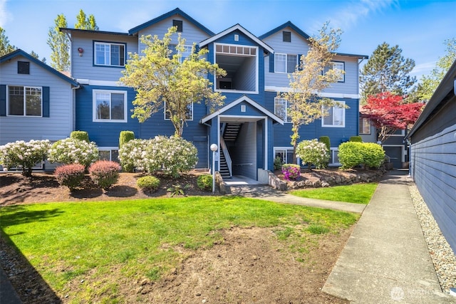 10825 SE 200th St Unit C104, Kent, WA 98031 - view of front of home featuring a front yard and stairway