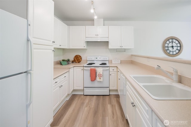 10825 SE 200th St Unit C104, Kent, WA 98031 - kitchen featuring white appliances, a sink, under cabinet range hood, and white cabinetry
