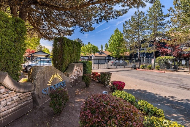 10825 SE 200th St Unit C104, Kent, WA 98031 - view of asphalt road featuring a gated entry