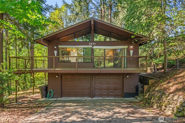2431 W Lynnwood Dr, Longview, WA 98632 - view of outdoor structure with driveway and an attached garage