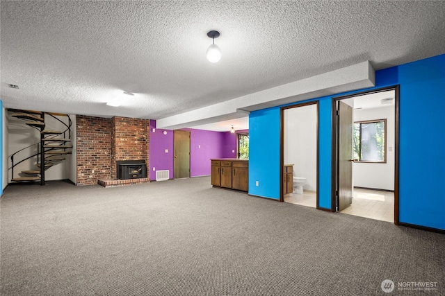 2431 W Lynnwood Dr, Longview, WA 98632 - unfurnished living room with carpet floors, a textured ceiling, and a fireplace
